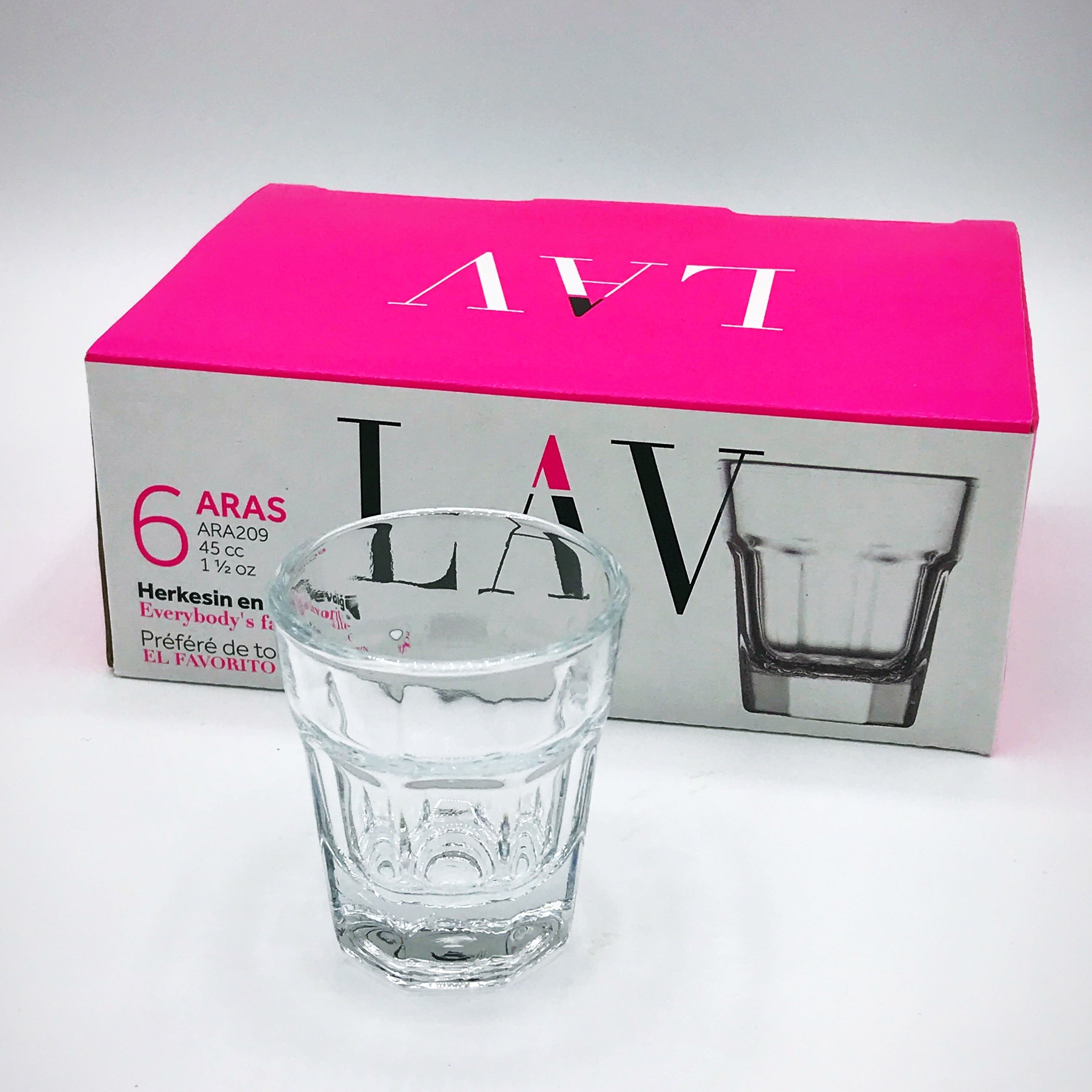A clear glass tumbler with a textured pattern in the foreground, positioned in front of its retail packaging box. The box is white with a vibrant hot pink top panel and features the brand name 'LAV' in large black letters.