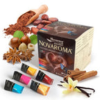 Novarese Zuccheri Novaroma chocolate-flavored gum capsules shown with their retail box and several flavor tubes, surrounded by chocolate powder, cocoa beans, hazelnuts, star anise, cinnamon sticks, vanilla beans, and a vanilla flower on a white background.